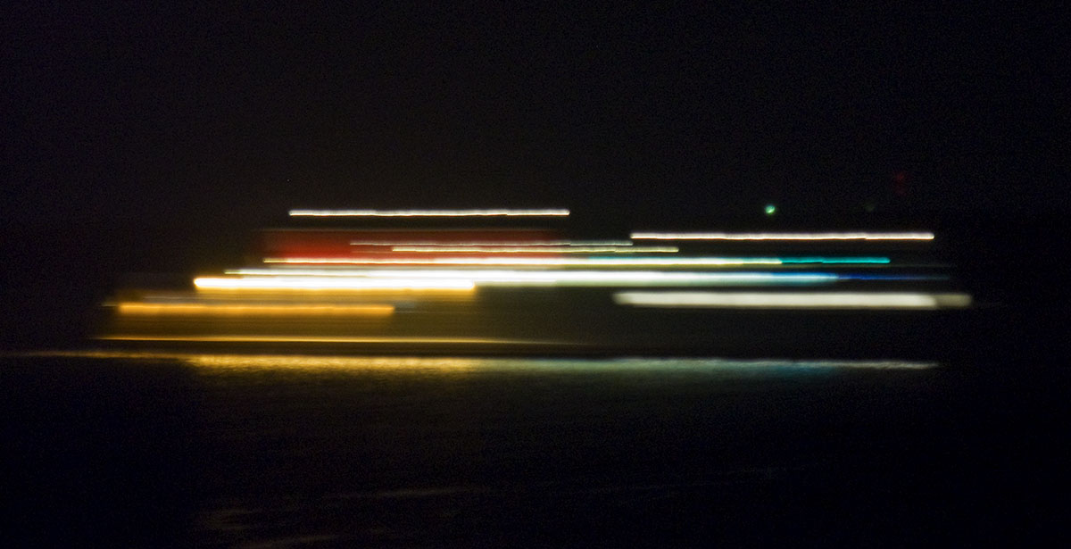 The ferry is passing by at night